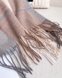 Close-up of color-block striped cashmere shawl scarf featuring elegant long tassel fringe