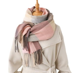 Plaid tassel scarf for women in pink, beige and grey plaid on a mannequin