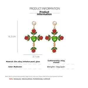 Detail view of red rose cross earrings with size dimensions 6.2cm by 3.7cm