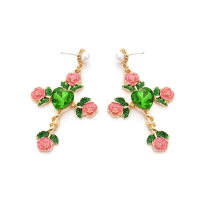 Cross earrings with pink enamel rose, green heart gem and white pearl on white background