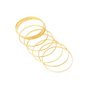 Minimalist gold thin bangle set featuring mixed sandblasted and polished metal finishes