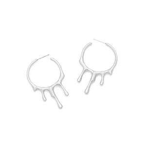 Detail of silver liquid metal hoop earrings with a polished fluid drip design