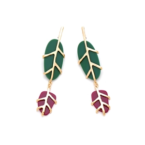 Elegant gold leaf drop earrings with green and red resin inlays on a white background