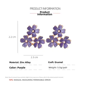 Detail view of purple enamel triple flower earrings with size specs and zinc alloy material