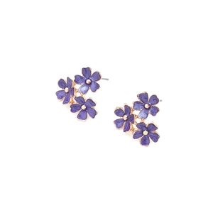 Detail of purple enamel flower cluster earrings with golden center beads and metal posts