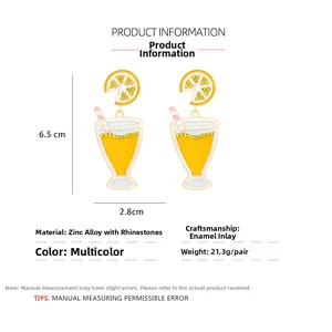 Detailed view of yellow lemon cocktail glass earrings with rhinestones and enamel finish