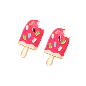 Close-up of pink enamel ice cream earrings with colorful sprinkles and golden sticks