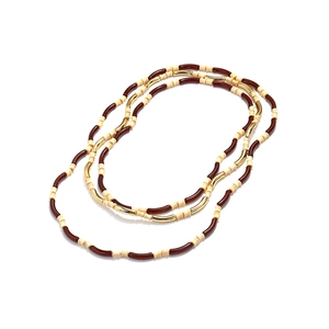 Bohemian multi-layer necklace with dark brown, cream, and gold bamboo-shaped resin beads