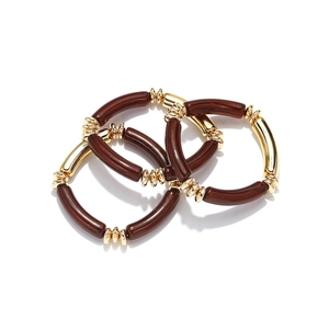 Three-piece bohemian resin bead bracelet set with golden accents and acrylic tubes