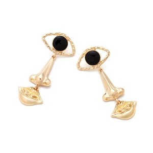 Vintage gold-plated alloy long earrings featuring abstract eye, nose, and lip shapes