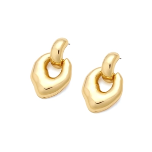 Macro detail of high-polish irregular golden earrings with a fluid geometric metal design