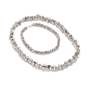 Macro shot of silver irregular metallic resin bead necklace and bracelet jewelry set