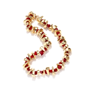 Bohemian chunky necklace featuring irregular gold metal beads and red resin stones