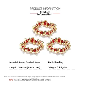 Detailed view of handmade beaded bracelets with gold resin and red crushed stones set
