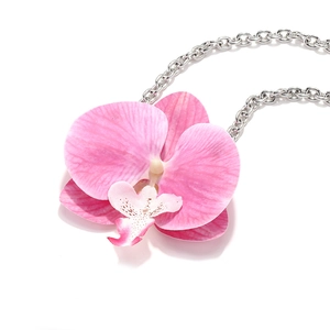 Elegant orchid flower pendant necklace with pink petals and silver chain on white background