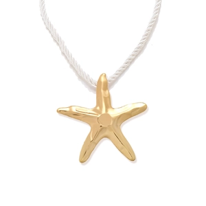 Golden starfish pendant with white twisted cord necklace on a clean white background