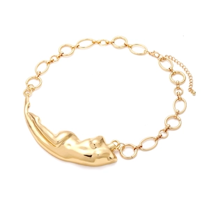 Close-up of gold liquid body necklace featuring abstract torso pendant and lobster clasp