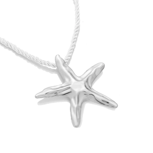 Macro shot of silver starfish pendant with textured white rope chain for beach wear