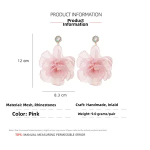 Handmade oversized pink organza flower earrings with rhinestone center detail and 12cm length