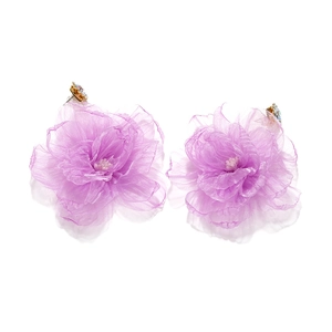 Detailed close-up of handmade purple organza flower earrings with crystal accents