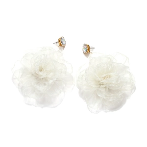 Detail of white organza flower earrings with gold plating and sparkling crystal center