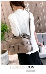 Detailed view of bronze soft leather tote bag with multi-zipper pockets and large capacity