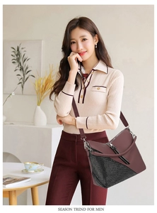 Close-up of burgundy leather crossbody bag with black mesh panels and silver zippers