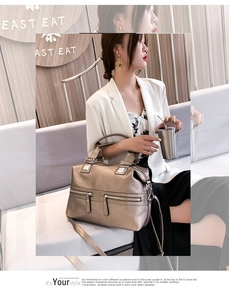 Detailed view of the metallic bronze PU leather bag with dual front zipper pockets