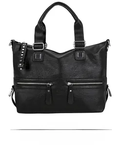 Detailed front view of black litchi pattern tote bag with silver zippers and rivets