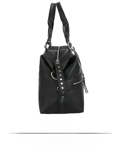 Detail of black pebbled leather tote bag with silver rivets and metal D-ring hardware