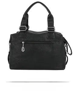 Rear view of black leather shoulder bag featuring a zipper pocket and silver buckles