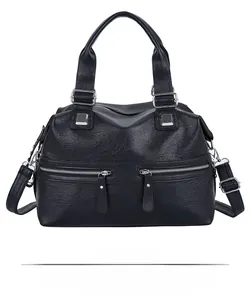 Front view of large blue textured leather tote bag with double handles and zip pockets