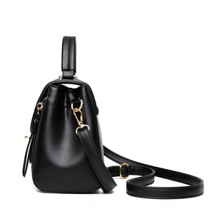 Minimalist black leather crossbody handbag for women with elegant gold hardware details