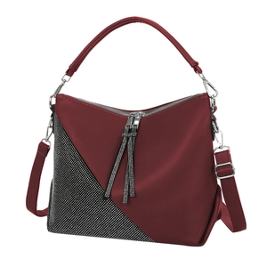 Burgundy faux leather handbag with rhinestone trim and decorative tassel detail