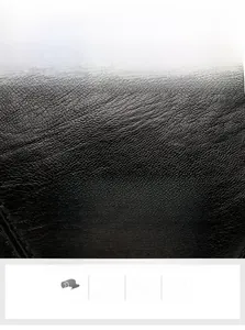 Macro detail of high-quality black water-washed PU leather texture with matte finish