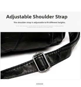 Detail of adjustable black leather strap with silver buckle on fashion shoulder bag