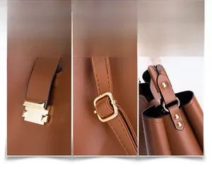 Détail du sac seau en cuir marron montrant la boucle dorée et les rivets de qualité