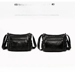 Front and back view of a black quilted PU leather crossbody bag with multiple zippers