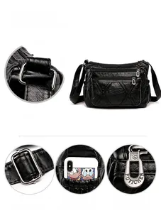 Close-up of litchi-grain leather texture with heavy-duty metal buckles and zippers