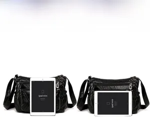 Detail view of multi-pocket soft PU leather crossbody bag showing size with iPad mini