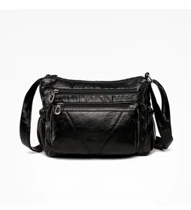 Rear view of black soft PU leather crossbody bag featuring multiple zipper pockets