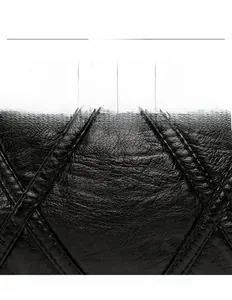 Detailed close-up of premium black PU leather texture with elegant diamond quilted stitching