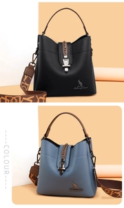 Close-up of pebble leather bucket bags with metal chain lock and vintage straps