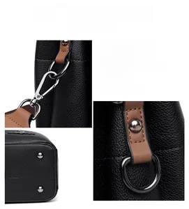Detail of lychee pattern leather, gunmetal hardware, and logo embossed on the bag bottom