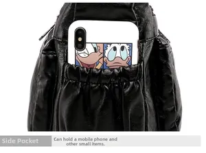 Close-up of black pebble leather handbag side pocket with a smartphone inside