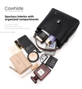 Internal view of black pebble leather handbag showing spacious capacity for essentials