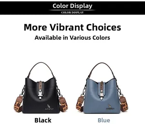 Detail view of black and blue soft leather bucket bags with printed wide straps