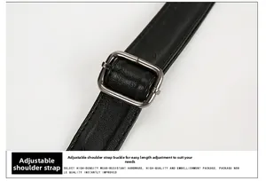 Detail of adjustable black leather strap with premium dark gunmetal buckle hardware