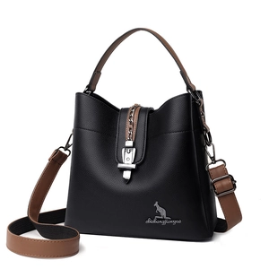 Black and brown leather bucket bag with top handle and adjustable shoulder strap