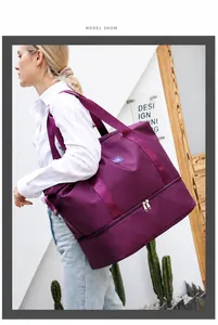 Purple travel bag detail showing the bottom independent zipper shoe compartment layer